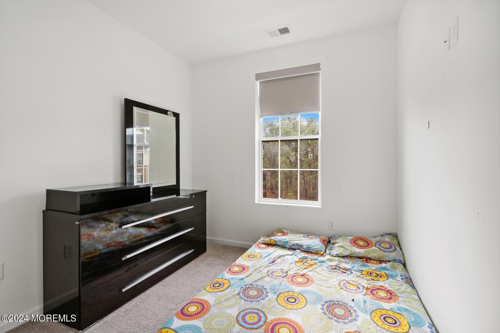 309 Revival Road Brick, NJ 08723 - Photo 21 of 37 a bedroom with a bed and a window