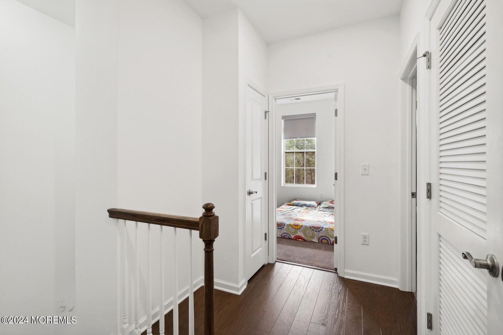 309 Revival Road Brick, NJ 08723 - Photo 24 of 37 a view of a hallway with wooden floor and stairs