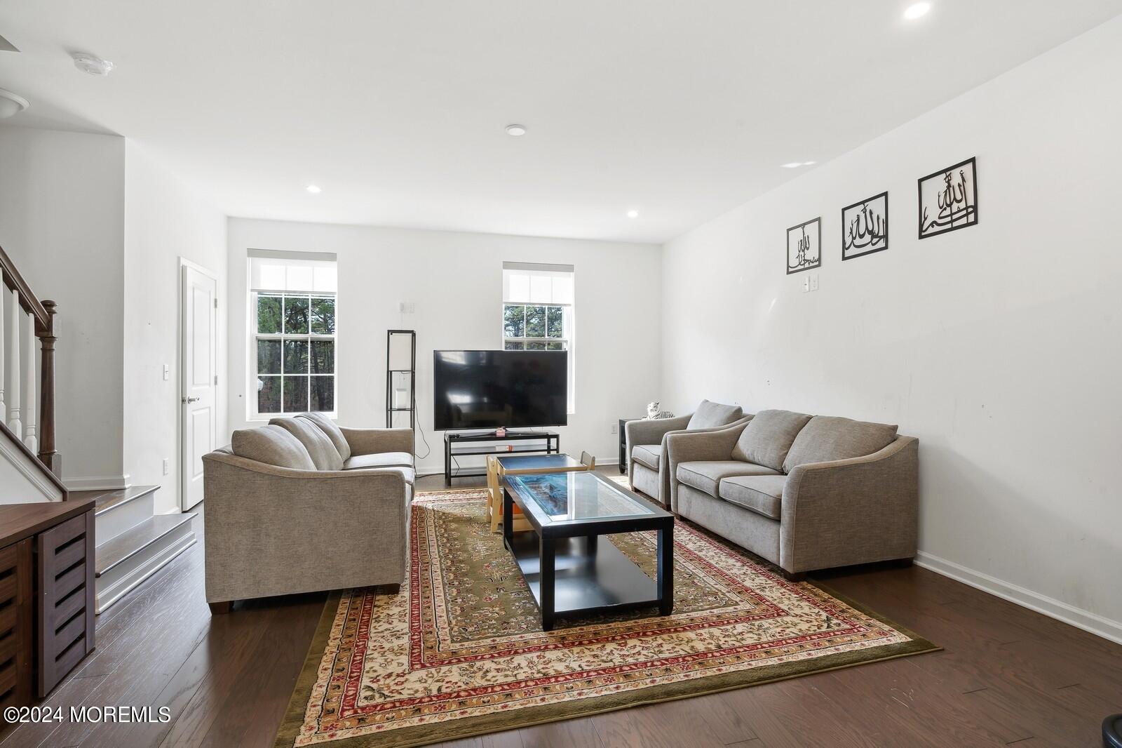 309 Revival Road Brick, NJ 08723 - Photo 3 of 37 a living room with furniture and a flat screen tv