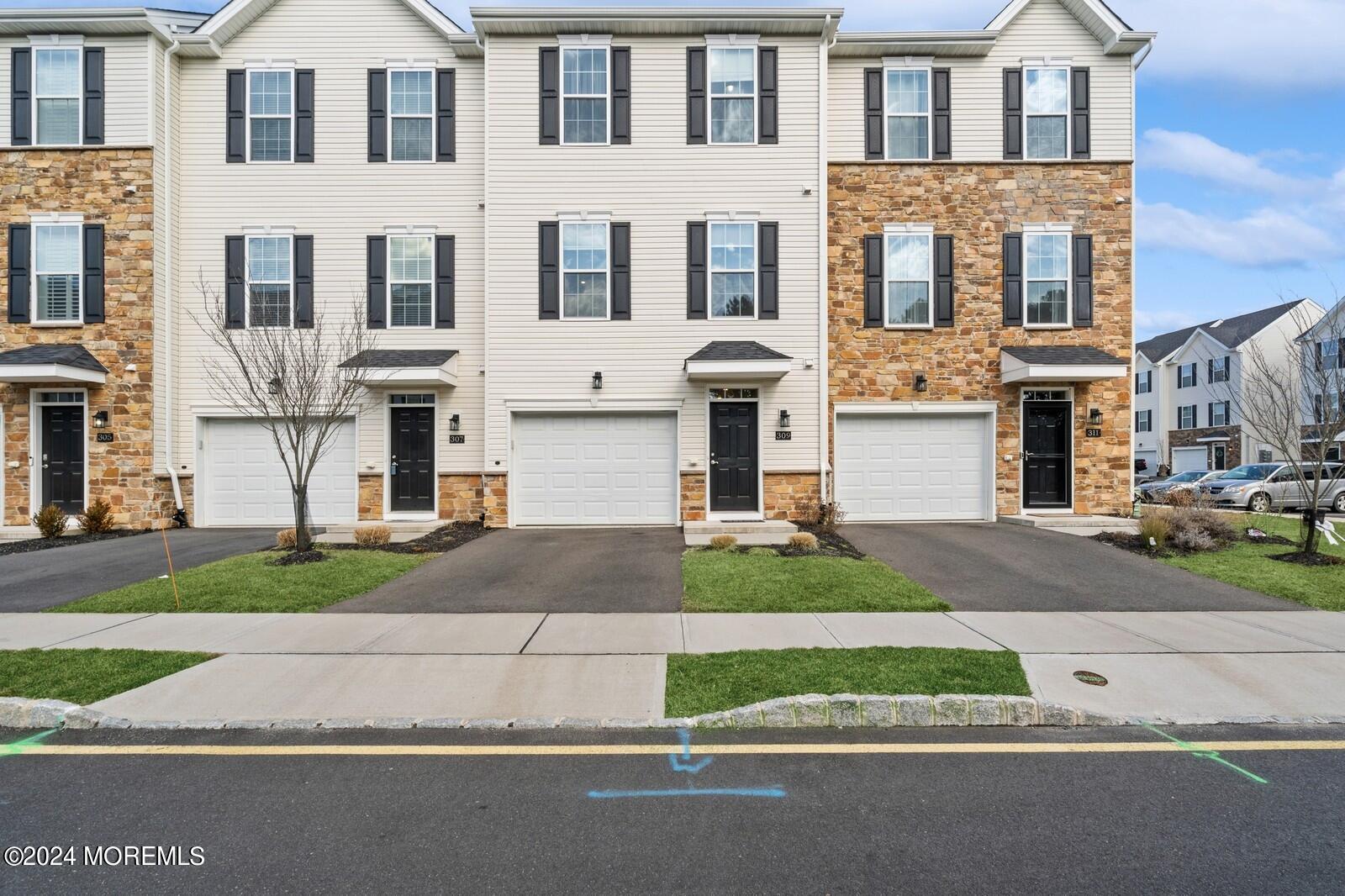309 Revival Road Brick, NJ 08723 - Photo 31 of 37 a front view of residential houses and street