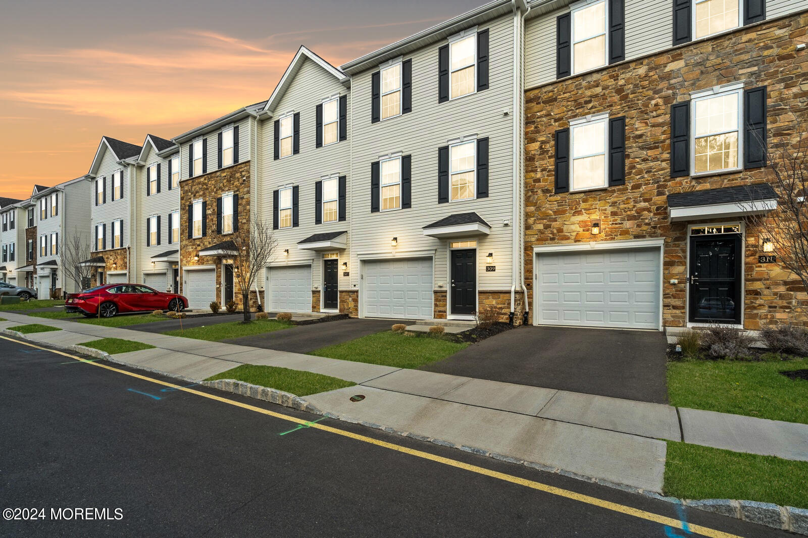 309 Revival Road Brick, NJ 08723 - Photo 32 of 37 a front view of a residential apartment building with a yard
