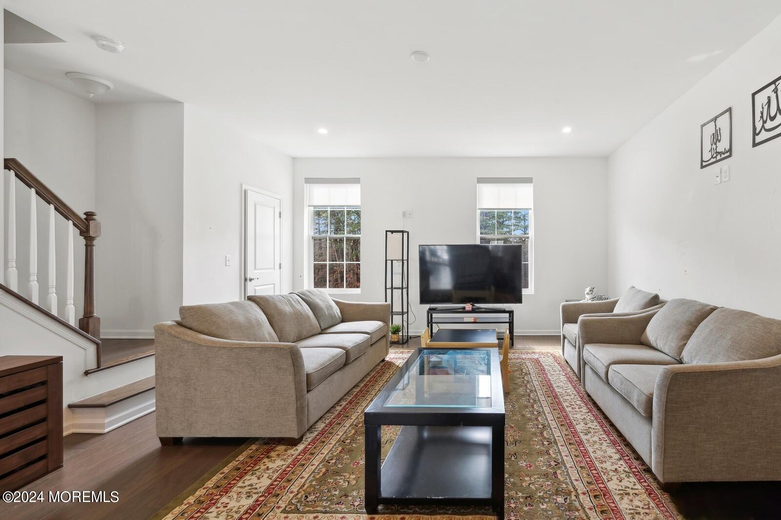 309 Revival Road Brick, NJ 08723 - Photo 6 of 37 a living room with furniture and a flat screen tv
