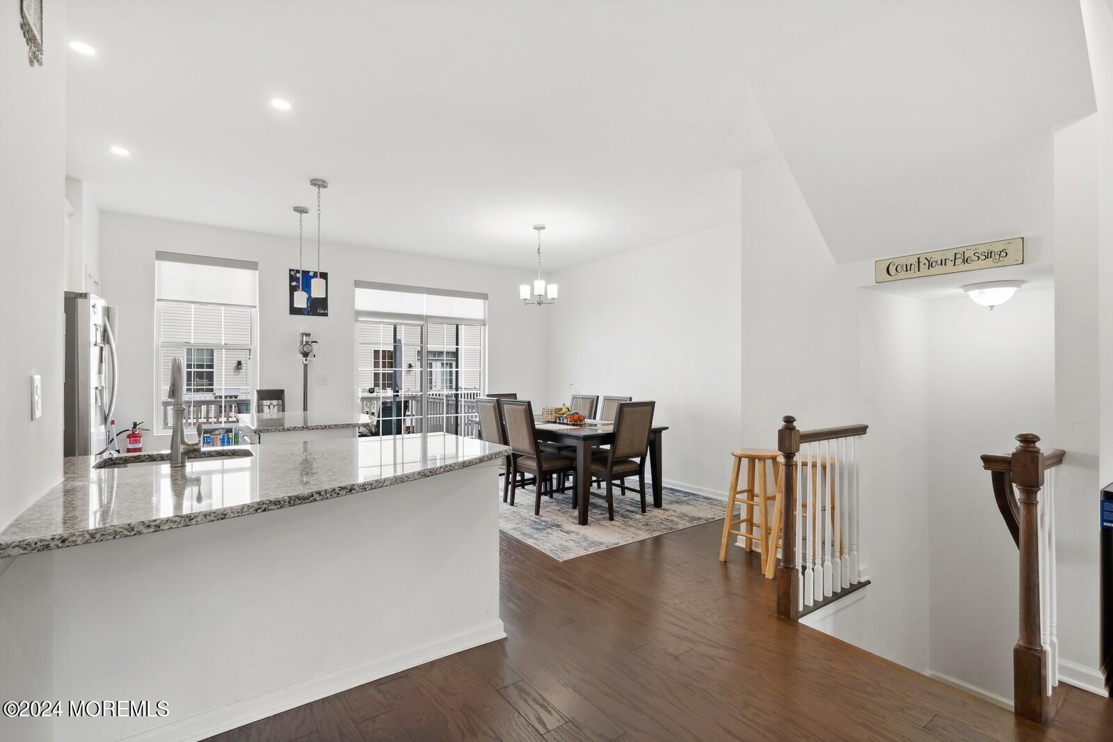 309 Revival Road Brick, NJ 08723 - Photo 10 of 37 a view of a dining room with furniture and wooden floor