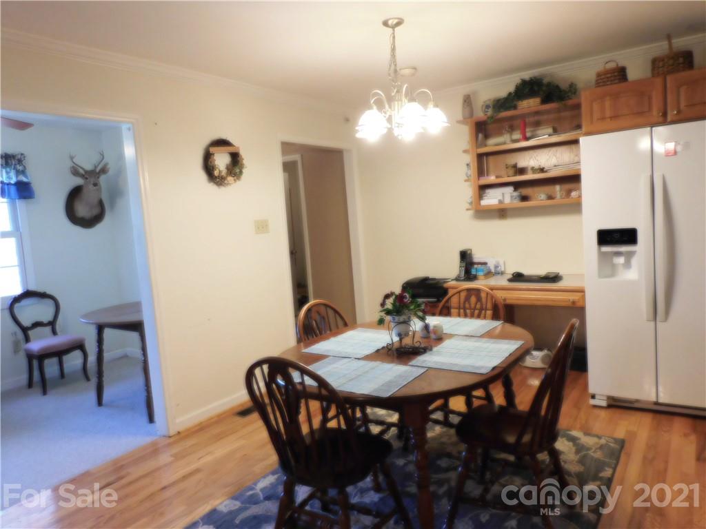 3800 Sherer Road Sharon, SC 29742 - Photo 11 of 42 a view of a dining room with furniture and wooden floor