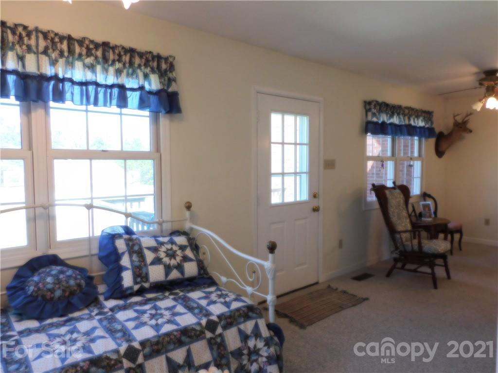 3800 Sherer Road Sharon, SC 29742 - Photo 16 of 42 a bedroom with a large bed and windows