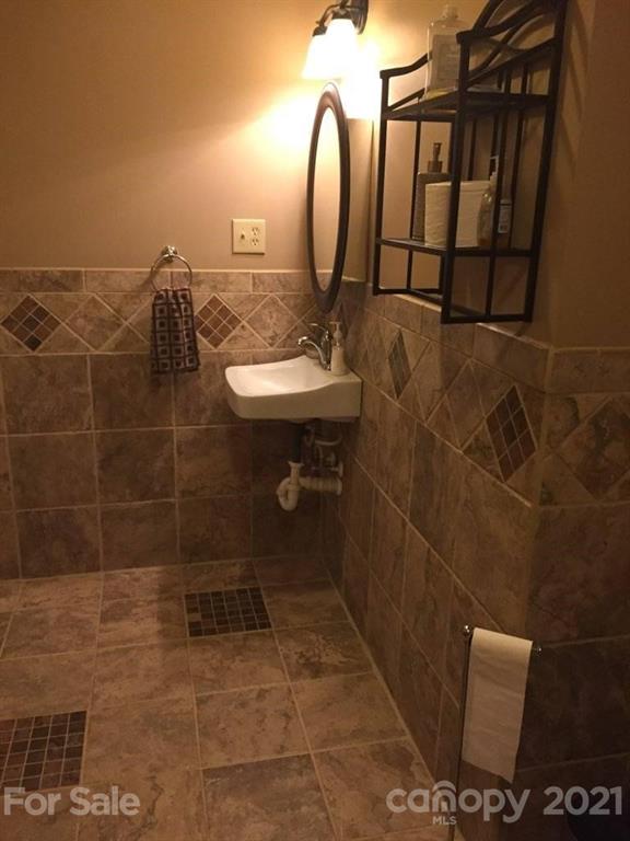 3800 Sherer Road Sharon, SC 29742 - Photo 22 of 42 a bathroom with a sink mirror and toilet