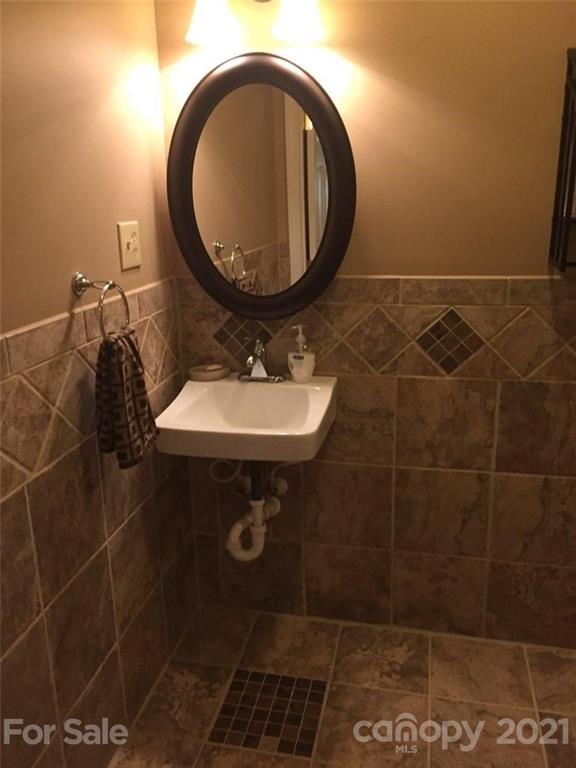 3800 Sherer Road Sharon, SC 29742 - Photo 23 of 42 a bathroom with a sink toilet and mirror