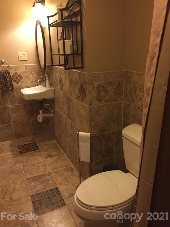 3800 Sherer Road Sharon, SC 29742 - Photo 25 of 42 a bathroom with a toilet and a mirror