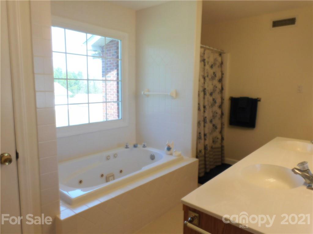3800 Sherer Road Sharon, SC 29742 - Photo 27 of 42 a bathroom with a tub and a shower