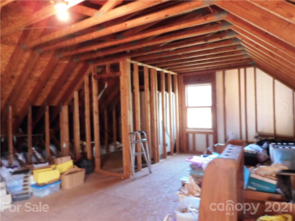 3800 Sherer Road Sharon, SC 29742 - Photo 32 of 42 a view of a bedroom with furniture and floor to ceiling window