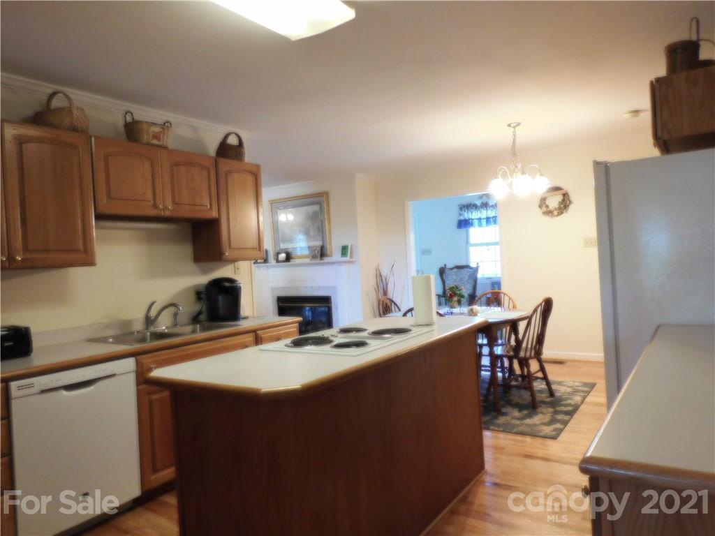 3800 Sherer Road Sharon, SC 29742 - Photo 7 of 42 a kitchen with kitchen island granite countertop a sink a counter top space and stainless steel appliances
