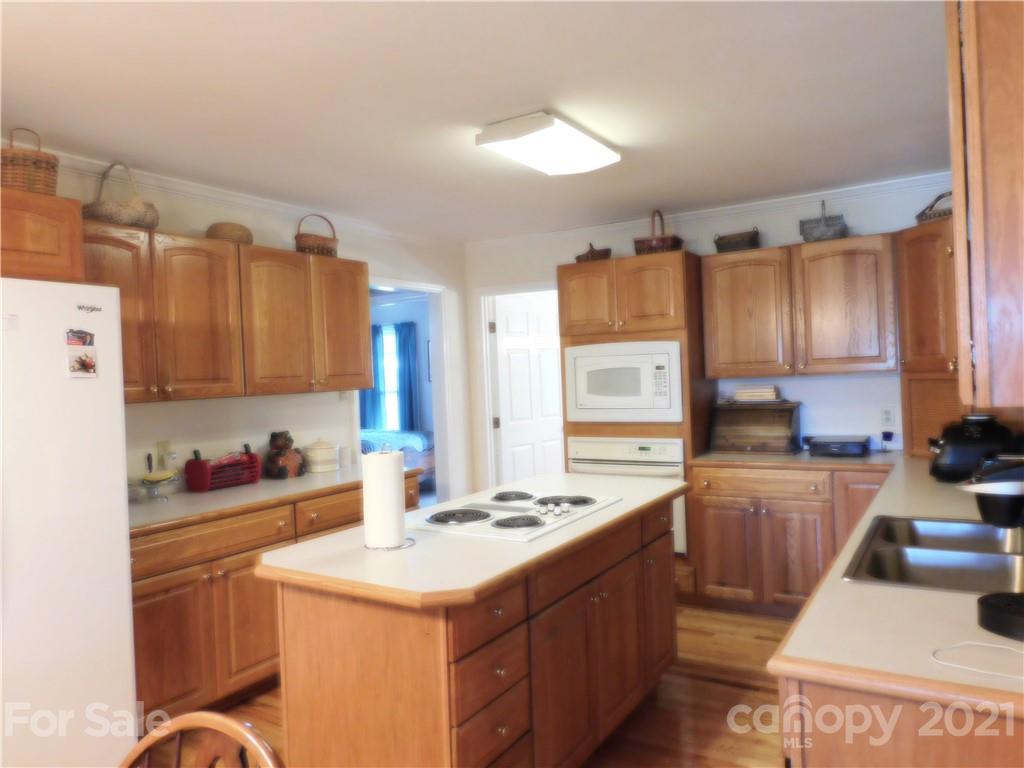 3800 Sherer Road Sharon, SC 29742 - Photo 8 of 42 a kitchen with a sink stove and cabinets