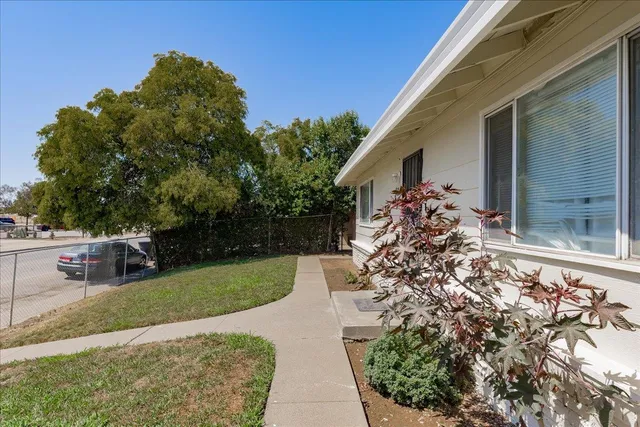 a view of a backyard of the house