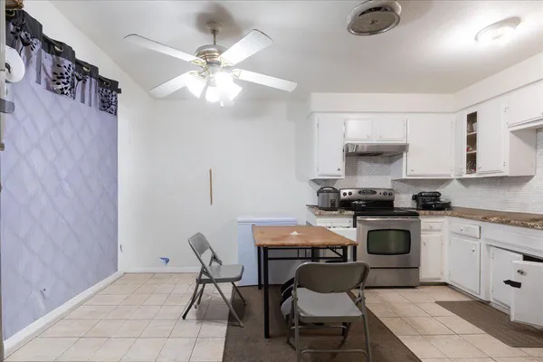 a kitchen with cabinets a sink and appliances