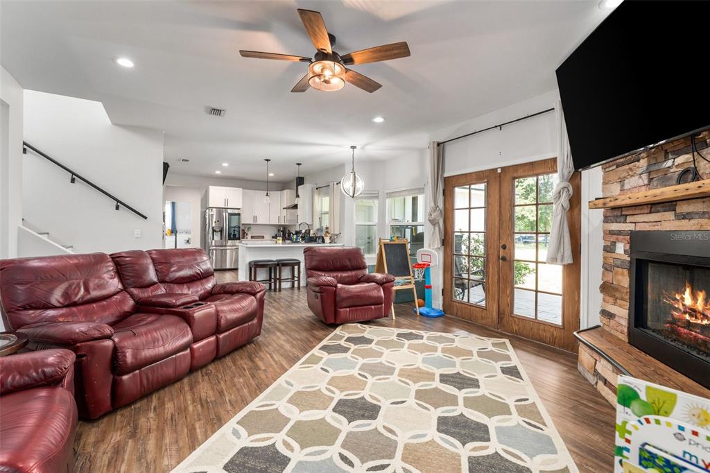 15971 Southeast 64th Street Lake Butler, FL 32054 - Photo 11 of 44 a living room with furniture fireplace and flat screen tv