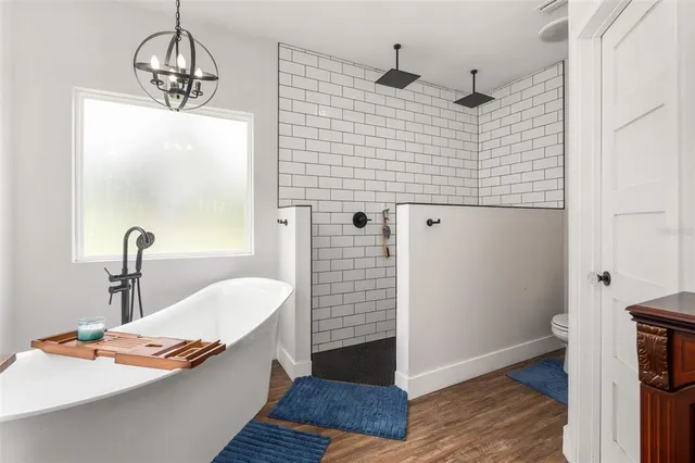 a bathroom with a sink a mirror and a shower