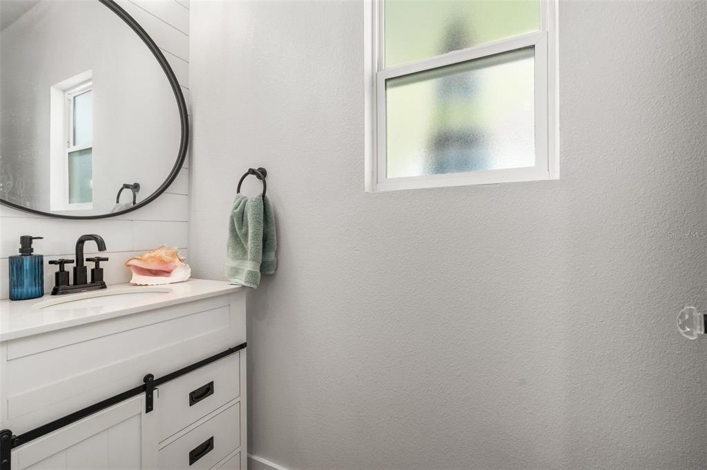 15971 Southeast 64th Street Lake Butler, FL 32054 - Photo 17 of 44 a bathroom with a sink and a mirror
