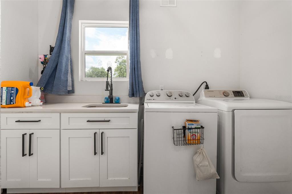 15971 Southeast 64th Street Lake Butler, FL 32054 - Photo 18 of 44 a utility room with dryer and washer