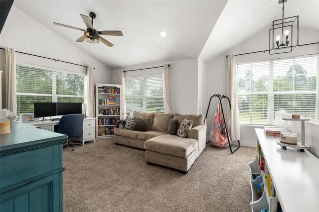 a living room with furniture and a window
