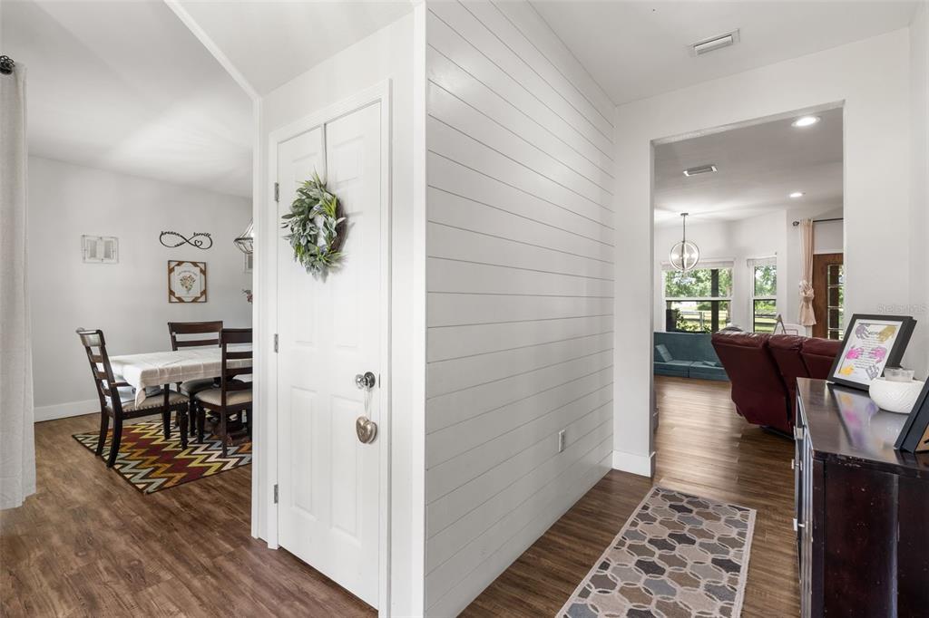 15971 Southeast 64th Street Lake Butler, FL 32054 - Photo 2 of 44 a workspace with wooden floor and a rug