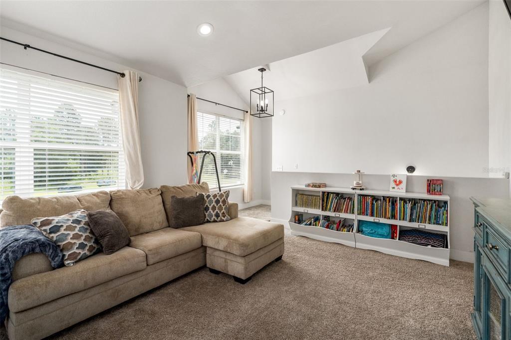 15971 Southeast 64th Street Lake Butler, FL 32054 - Photo 21 of 44 a living room with furniture and a large window