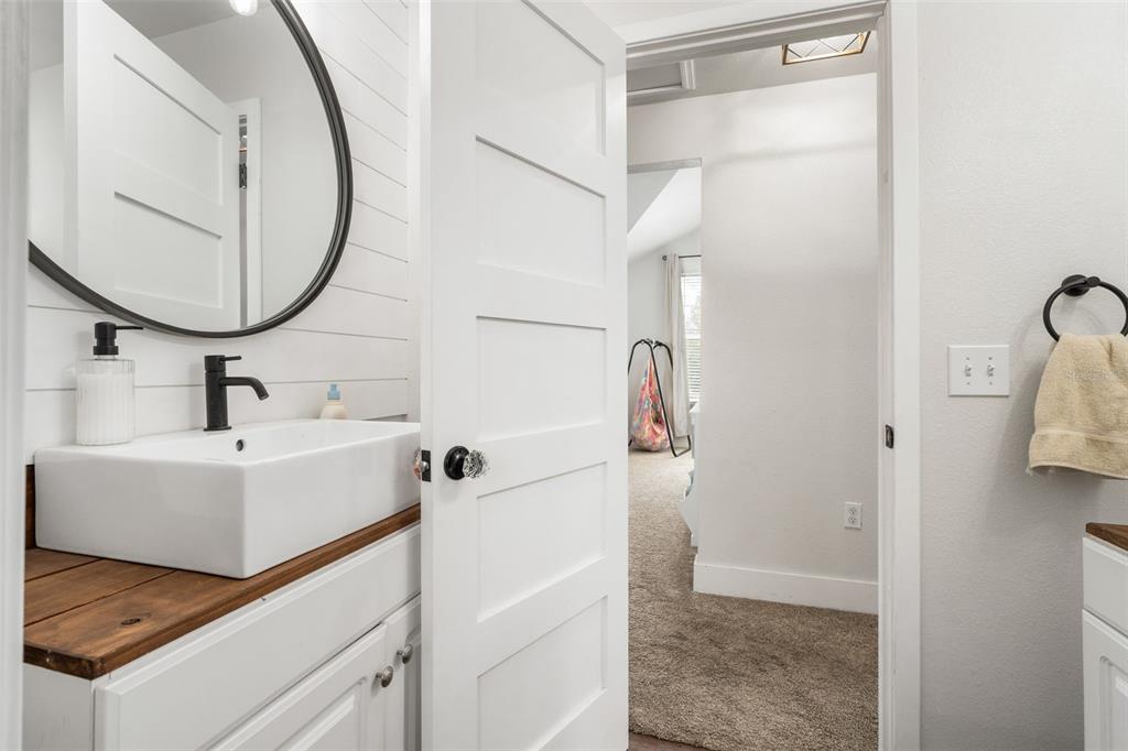 15971 Southeast 64th Street Lake Butler, FL 32054 - Photo 23 of 44 a bathroom with a sink and a mirror
