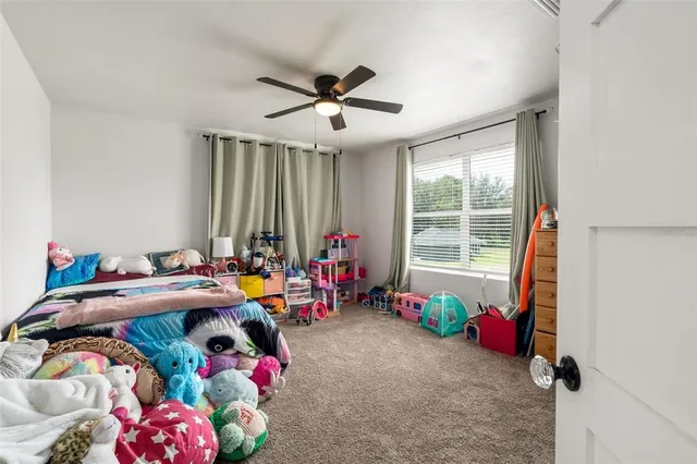 a bedroom with furniture and a window