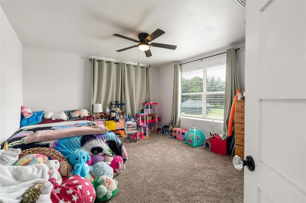 15971 Southeast 64th Street Lake Butler, FL 32054 - Photo 24 of 44 a bedroom with furniture and a window