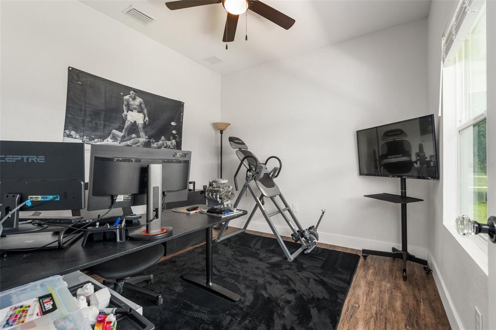 15971 Southeast 64th Street Lake Butler, FL 32054 - Photo 3 of 44 a living room with furniture and a flat screen tv