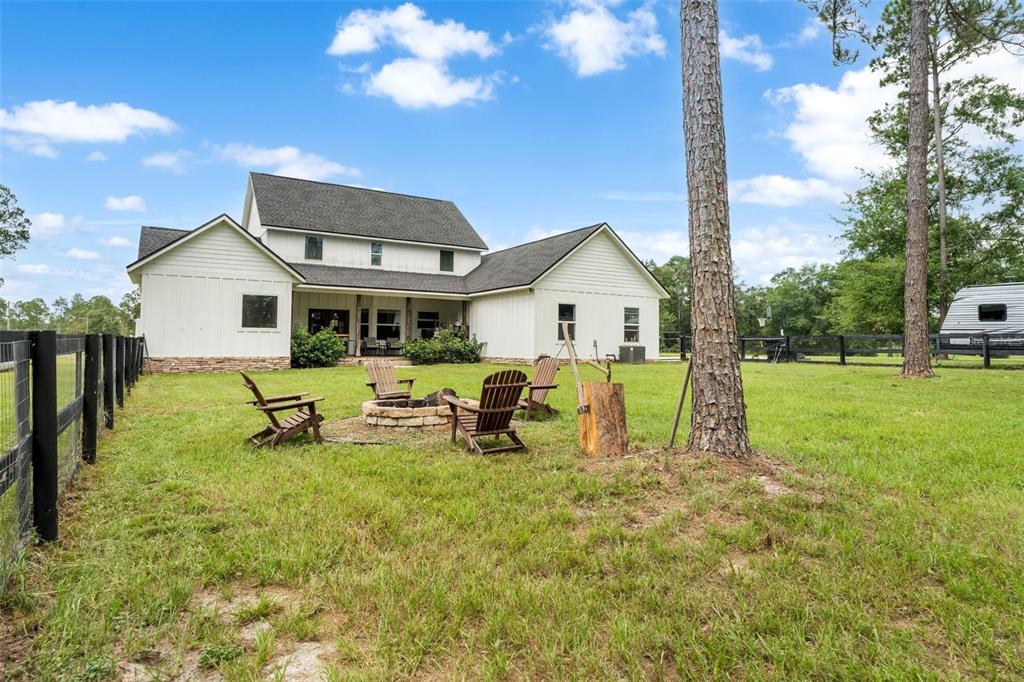 15971 Southeast 64th Street Lake Butler, FL 32054 - Photo 33 of 44 a view of a house with backyard porch and sitting area