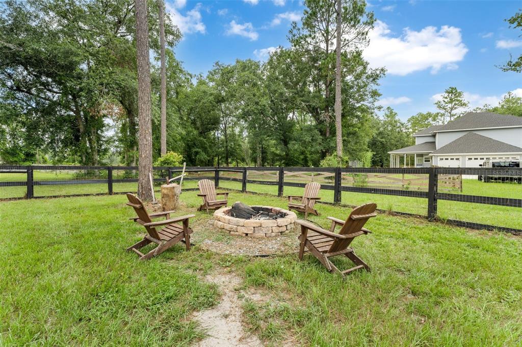 15971 Southeast 64th Street Lake Butler, FL 32054 - Photo 34 of 44 a green bench sitting in the middle of a park