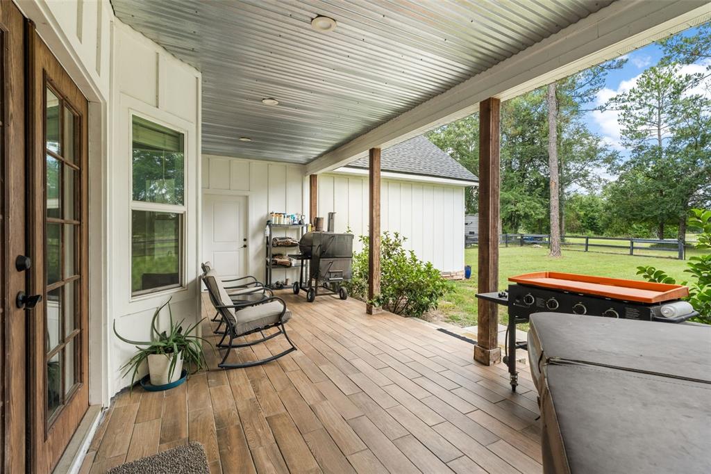15971 Southeast 64th Street Lake Butler, FL 32054 - Photo 36 of 44 a house view with a seating space and a ocean view