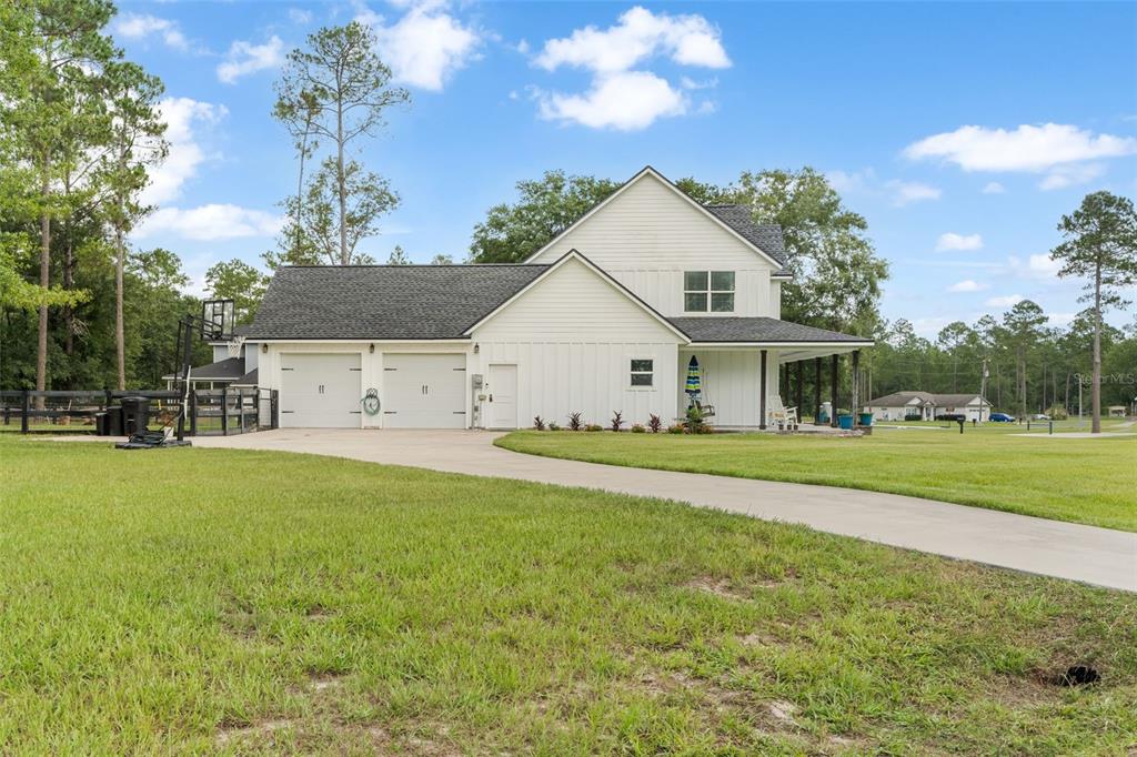 15971 Southeast 64th Street Lake Butler, FL 32054 - Photo 38 of 44 a view of a house with a yard