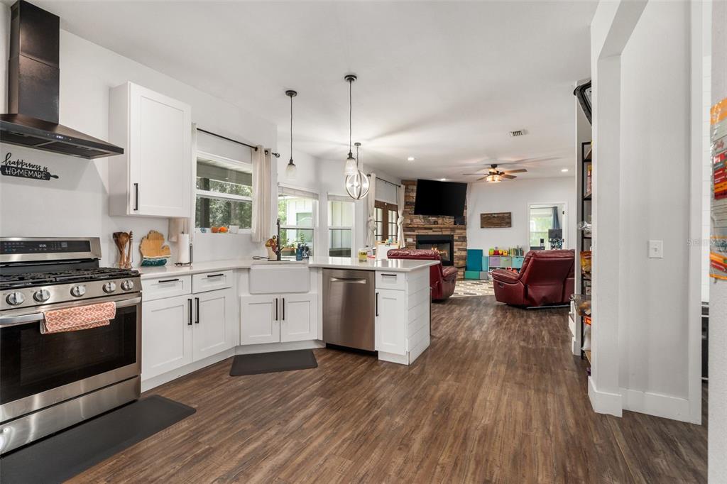 15971 Southeast 64th Street Lake Butler, FL 32054 - Photo 6 of 44 a kitchen with sink a stove and cabinets