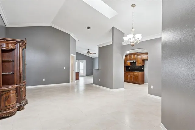 a kitchen with granite countertop a sink stainless steel appliances and cabinets