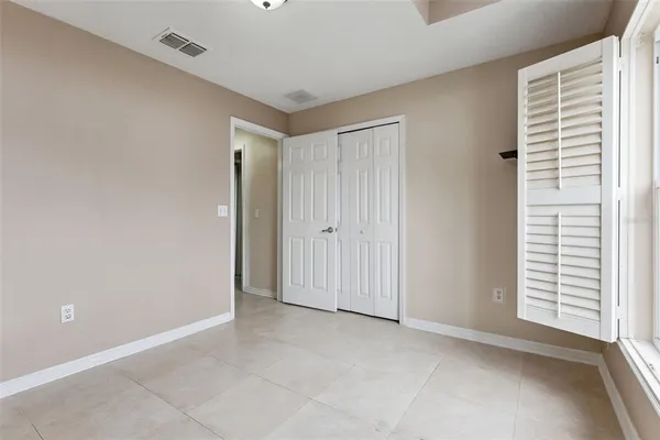 a view of an empty room with a window