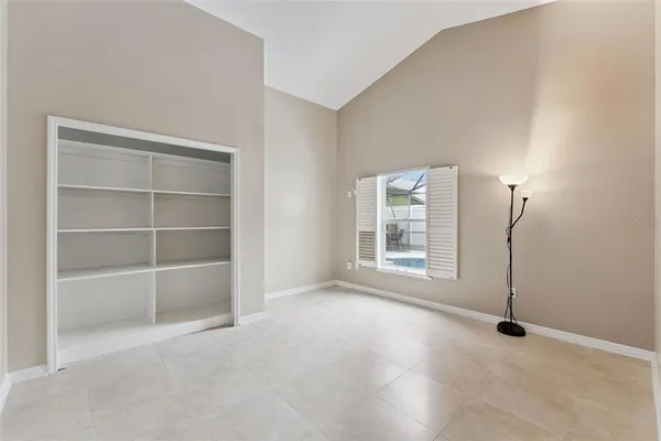 a kitchen with stainless steel appliances granite countertop a refrigerator and white cabinets