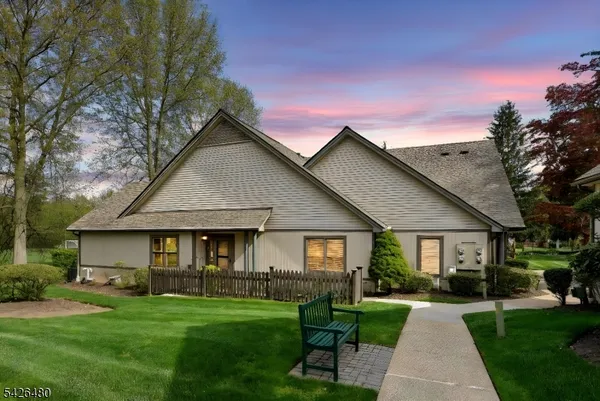a kitchen with stainless steel appliances granite countertop a stove top oven a sink dishwasher and cabinets with wooden floor