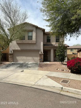 a view of a house with a yard and garage