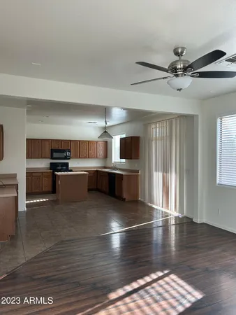 a view of kitchen with microwave and cabinets