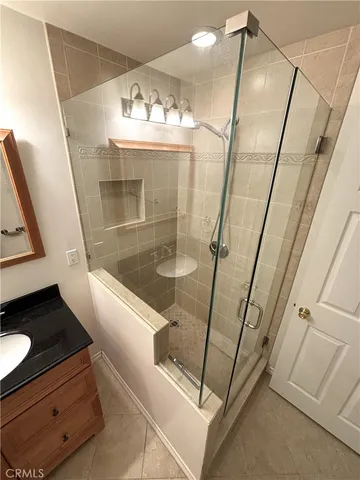 a bathroom with a sink and mirror