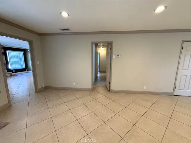 an empty room with mirror