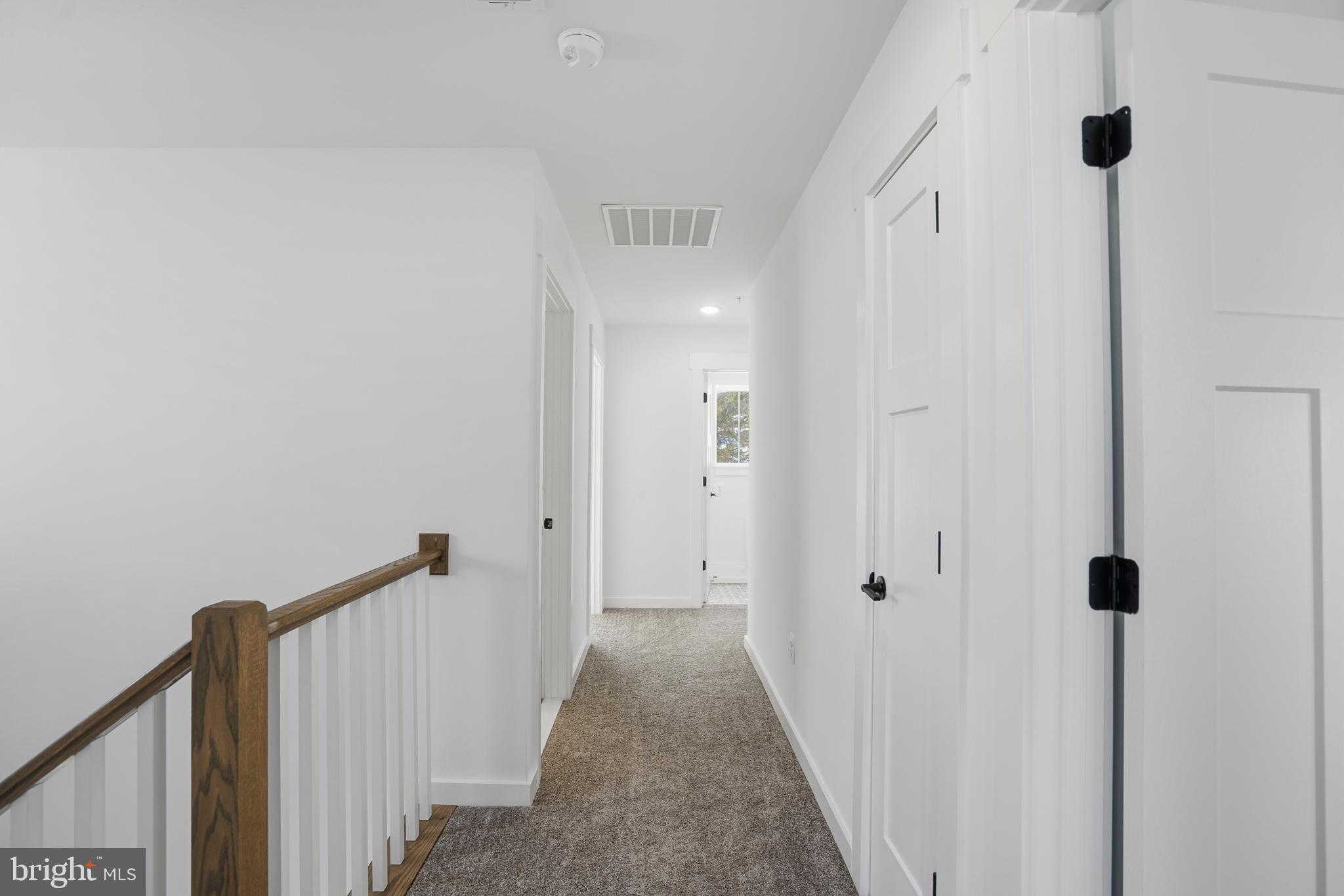 26 Walnut Street Middletown, MD 21769 - Photo 23 of 41 a view of a hallway with wooden floor and closet