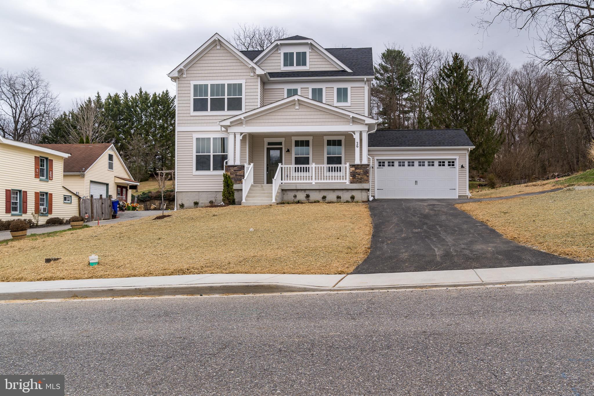 26 Walnut Street Middletown, MD 21769 - Photo 3 of 41 a front view of a house with a yard and garage