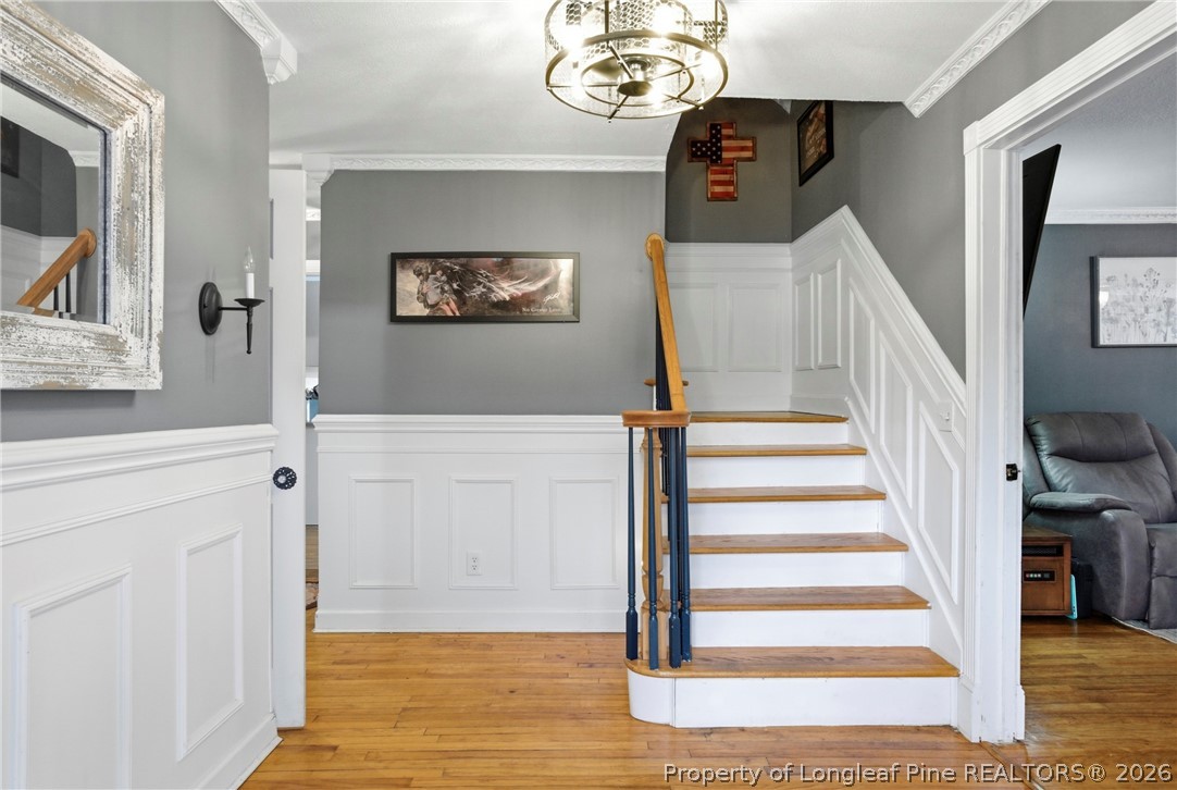 732 County Line Road Roseboro, NC 28382 - Photo 11 of 30 a view of a hallway with wooden floor and staircase