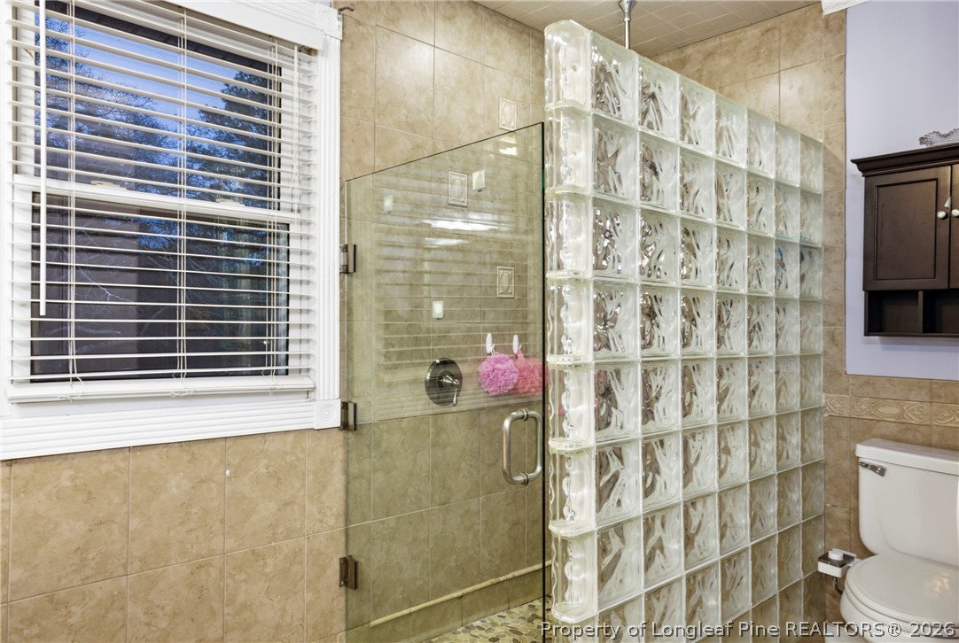 732 County Line Road Roseboro, NC 28382 - Photo 15 of 30 a bathroom with a shower curtain