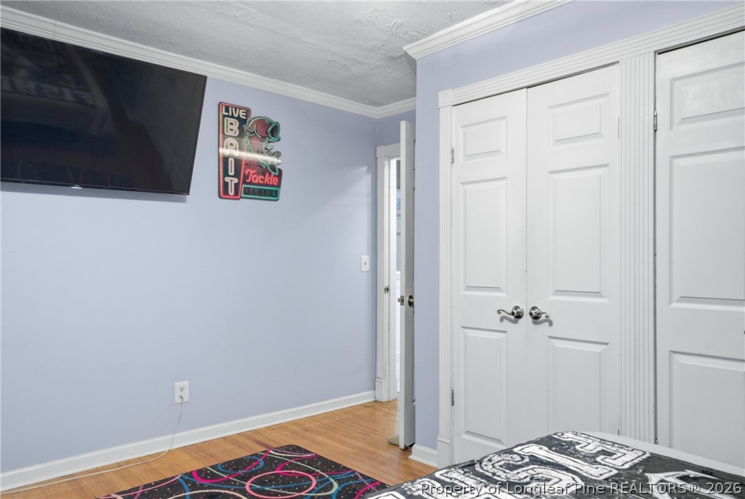 732 County Line Road Roseboro, NC 28382 - Photo 17 of 30 a bedroom with a bed and a view of bathroom
