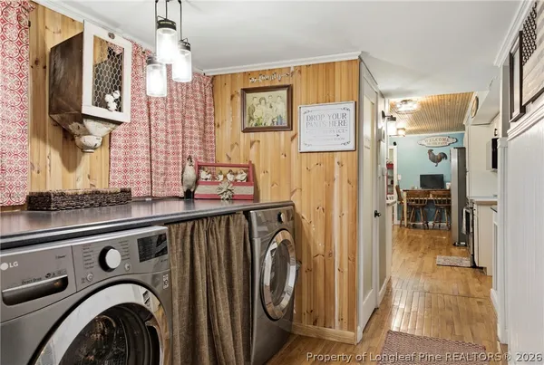 a view of a hallway with washer and dryer