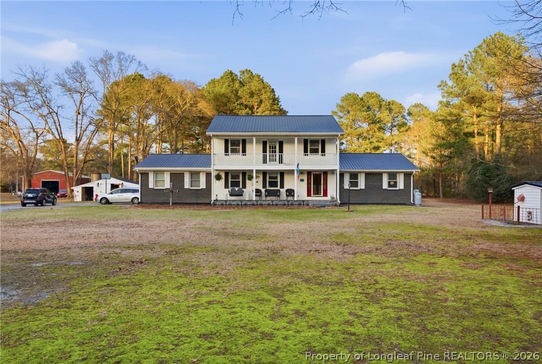 732 County Line Road Roseboro, NC 28382 - Photo 2 of 30 a front view of a building with a garden