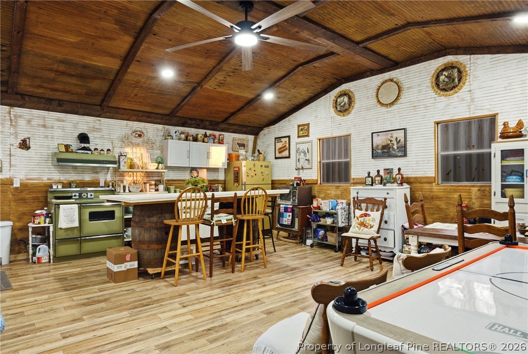 732 County Line Road Roseboro, NC 28382 - Photo 24 of 30 a view of a dining hall with lots of chairs and wooden floor